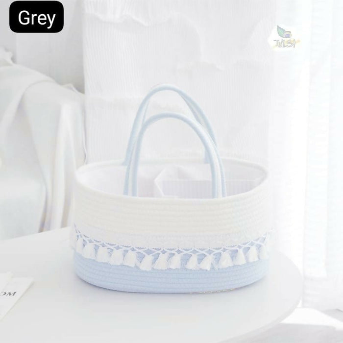 Baby diaper caddy bag with multiple storage compartments, cute design, organized sections, sturdy handles, and convenient storage for diapers, wipes, bottles, and baby essentials.