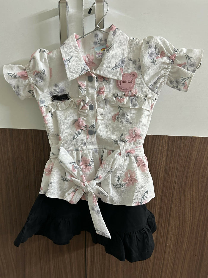 Floral top with ruffled details