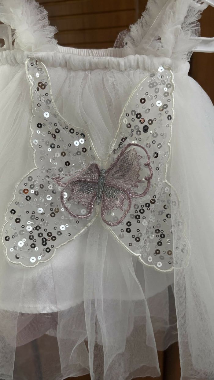 White dress with butterfly wings and sequins