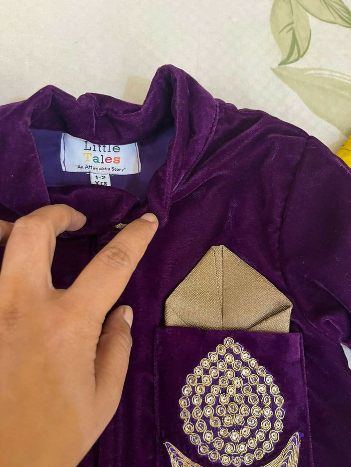 Elegant purple baby sherwani with intricate detailing, soft fabric, and comfortable fit, perfect for festive occasions and celebrations.