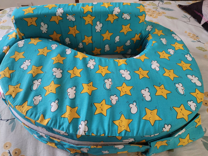 BABYHUG Cotton Feeding Pillow with Belt in Blue Star Print, Almost New condition, featuring soft cushioned support, comfortable cotton fabric, and a secure belt for convenient breastfeeding and bottle-feeding sessions.
