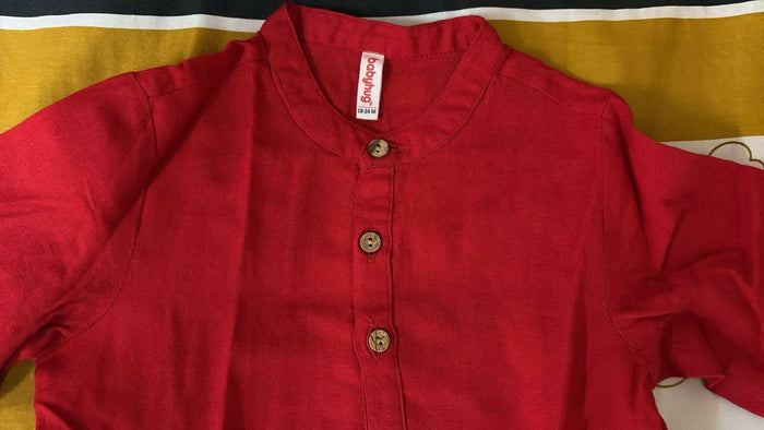 Red jacket with a brand label on a yellow background