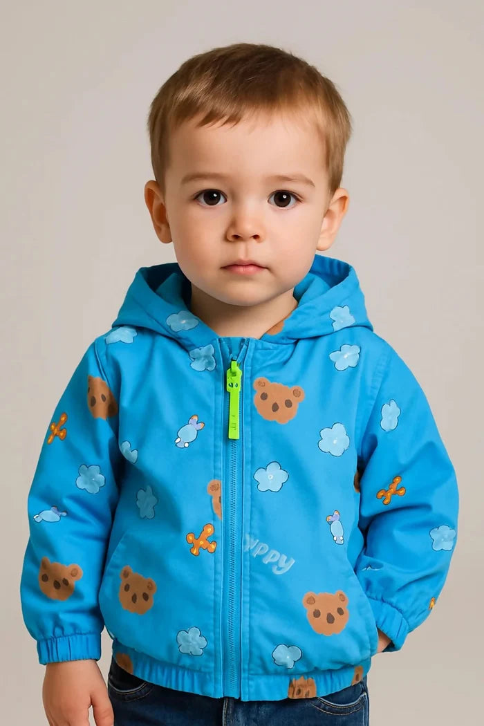 Child wearing a blue jacket with bear prints