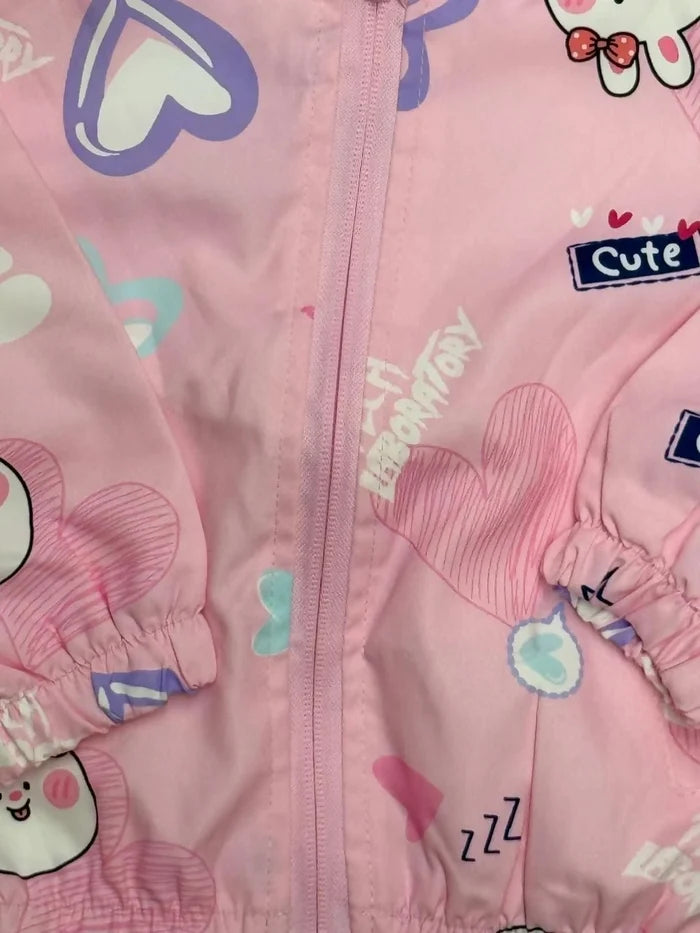 Pink children's jacket with cartoon characters and text