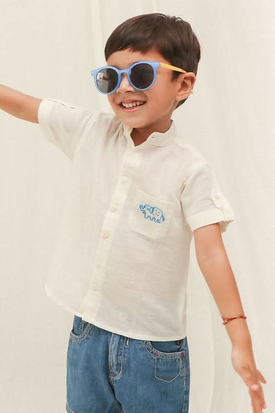 Shop now for a classic off-white cotton shirt for little boys, perfect for both casual and formal occasions!