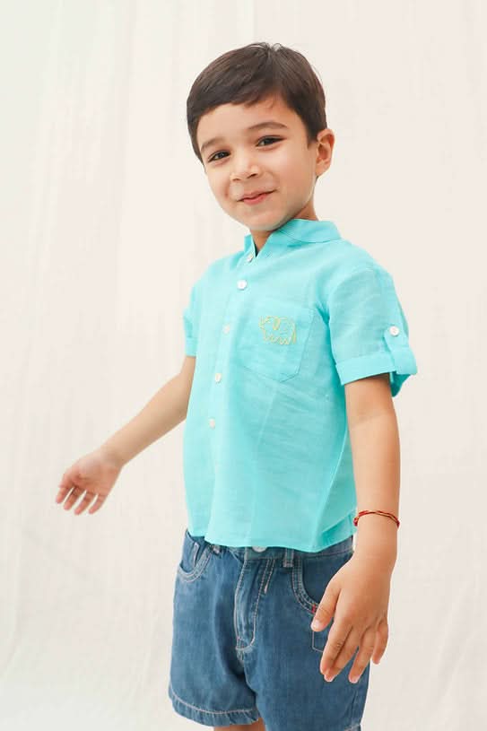 Discover the comfortable blue 100% cotton shirt for boys, offering soft, breathable fabric and versatile styling for any occasion.