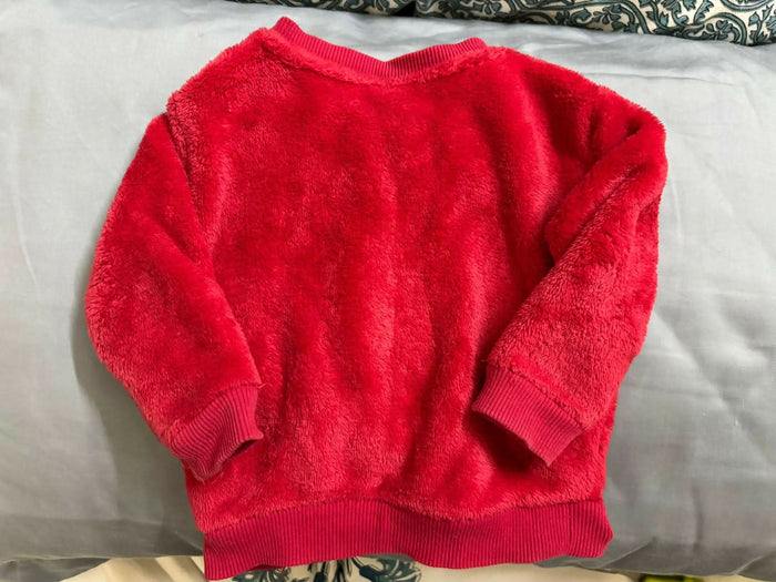 Wrap your little one in warmth and magic with this soft faux fur sweater from H&amp;M’s Disney collection.