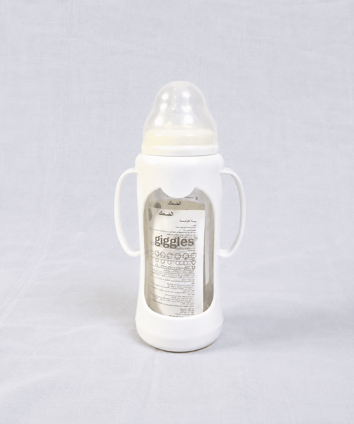 Giggles 210ml Glass Feeding Bottle with dual handles, BPA-free glass, soft silicone nipple, and ergonomic design for comfortable, safe, and easy feeding for babies learning to hold a bottle.