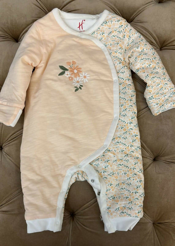 Keep your baby cozy and stylish with the HAMLEYS Baby Quilt Romper, crafted from soft and breathable fabric for all-day comfort. The quilted design adds warmth and texture, making it perfect for cooler days. Ideal for playtime or outings, this romper combines style and functionality for your little one.