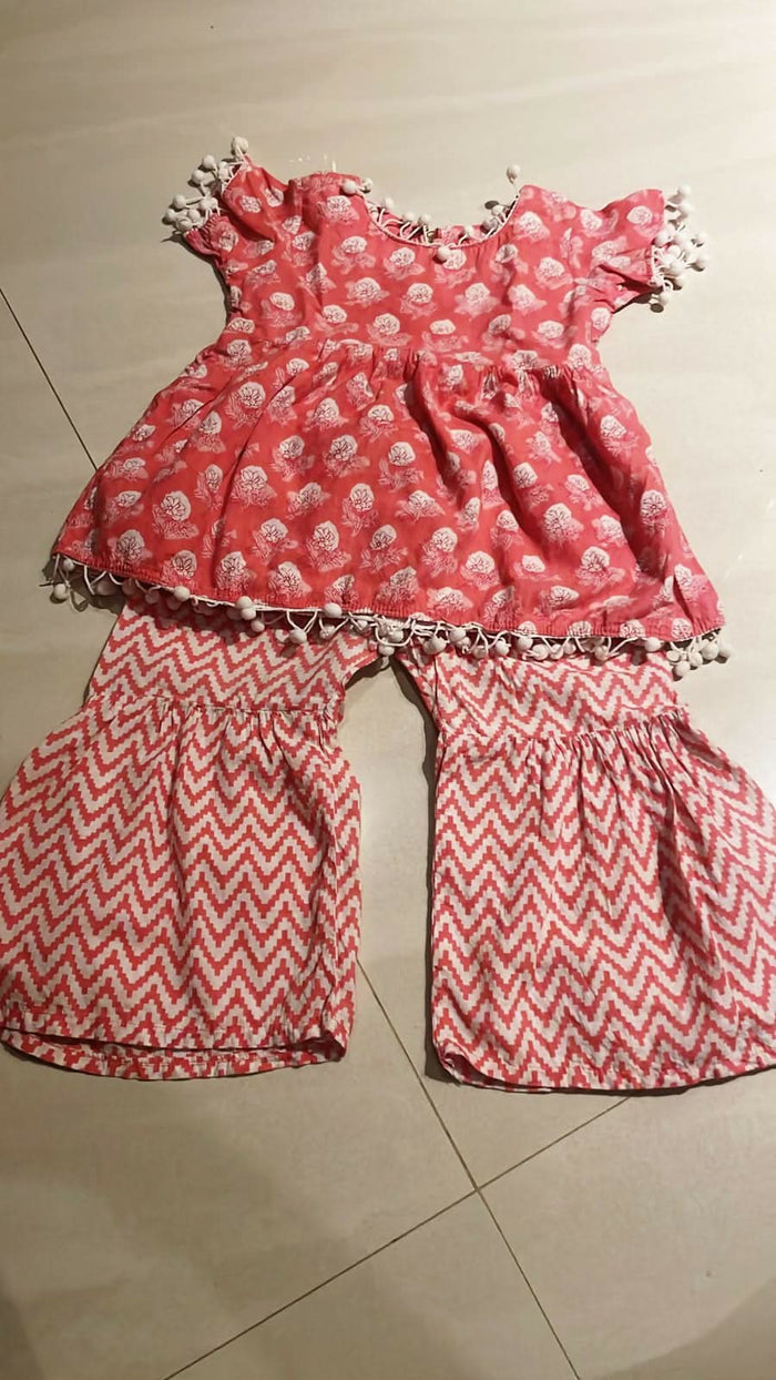 Elevate your baby girl's style with our Kurta and Sharara Set, crafted for traditional charm and comfort.
