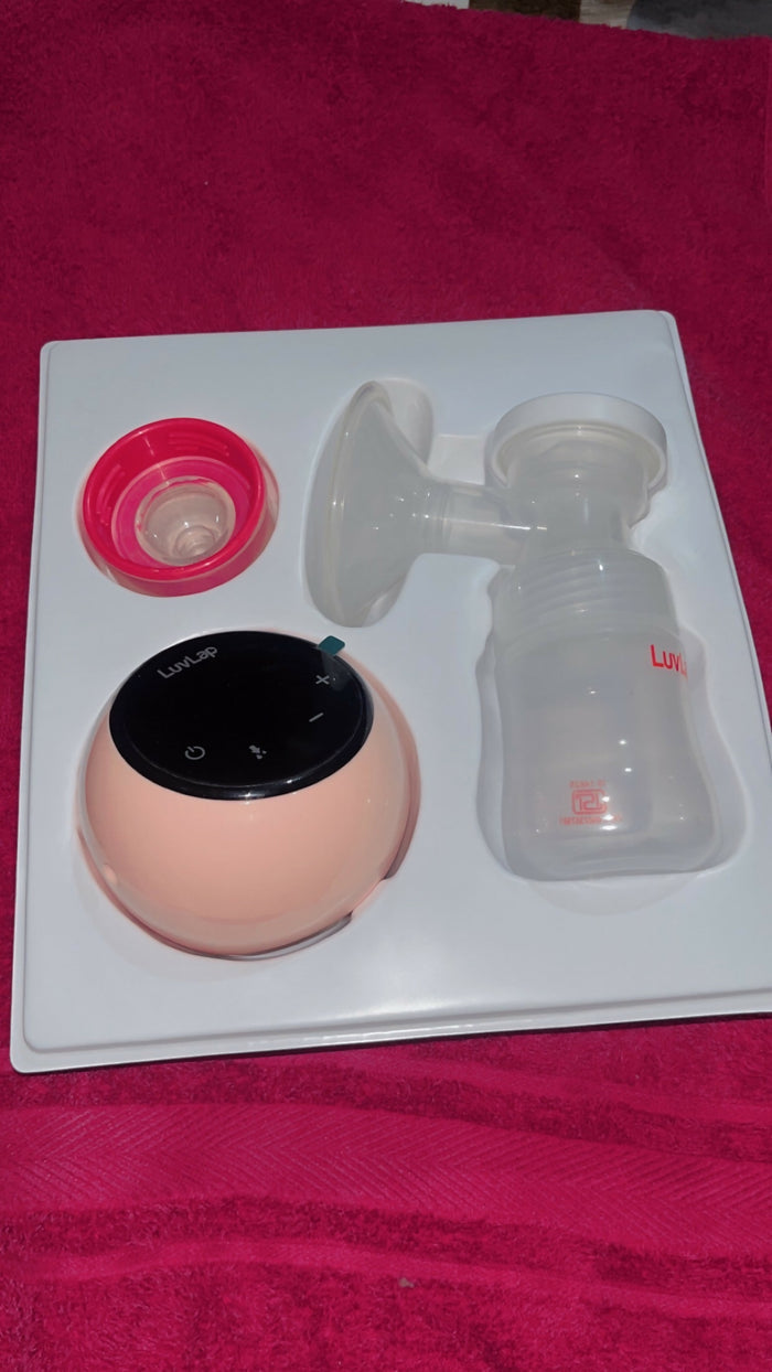 LuvLap Adore Electric Breast Pump in Almost New condition with adjustable suction levels, multiple pumping modes, soft silicone breast cushion, compact design, and easy-to-use controls for comfortable milk expression.