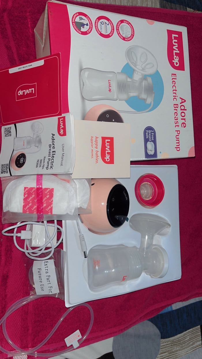 LuvLap Adore Electric Breast Pump in Almost New condition with adjustable suction levels, multiple pumping modes, soft silicone breast cushion, compact design, and easy-to-use controls for comfortable milk expression.