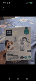 MEE MEE Manual Breast Pump with ergonomic hand pump, soft silicone massage cushion, BPA-free components, lightweight portable design, and comfortable manual milk expression for breastfeeding mothers.