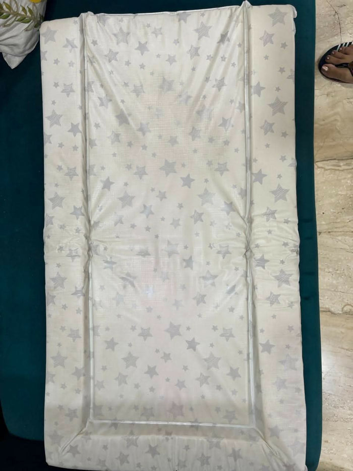 MOTHERCARE padded waterproof changing mat with grey stars – soft, comfy, and easy to clean.