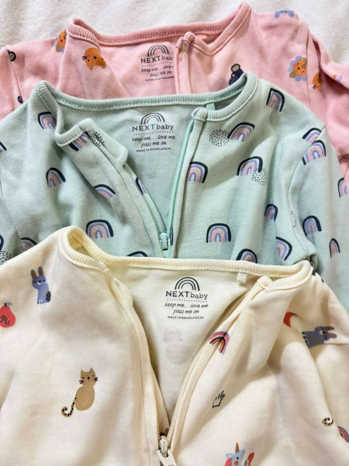 Buy NEXT Baby Sleep Suits – Pack of 3 super soft cotton onesies with 2-way zippers and built-in mitts for all-night comfort.