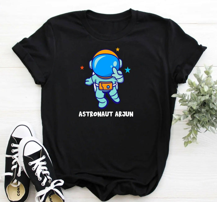 Black t-shirt with an astronaut graphic and 'Astronaut Arjun' text on a white background