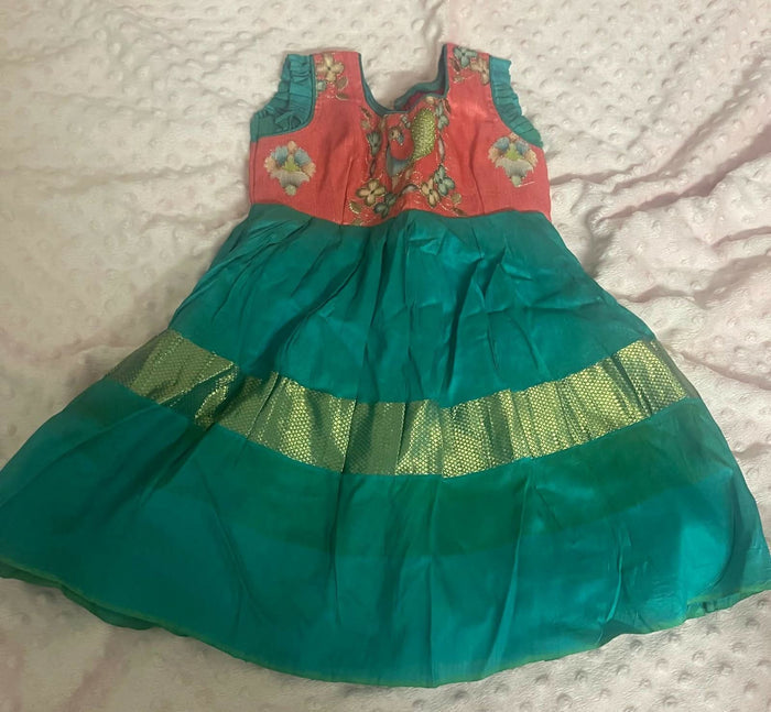 Celebrate tradition with elegance in our Pure Ikkat Pattu Baby Frock/Dress - a timeless masterpiece for your little princess.