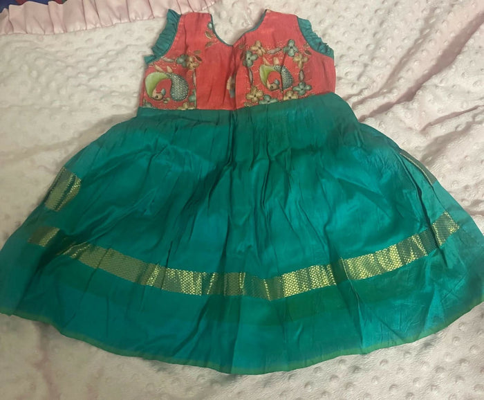 Celebrate tradition with elegance in our Pure Ikkat Pattu Baby Frock/Dress - a timeless masterpiece for your little princess.