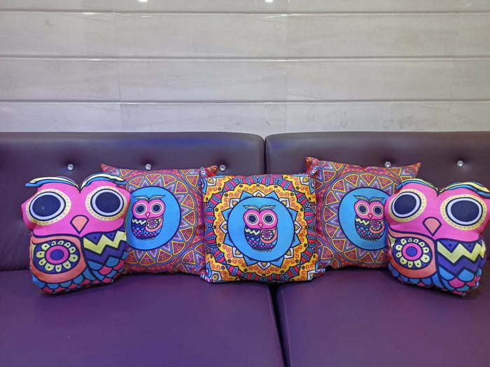 Colorful owl-themed cushions